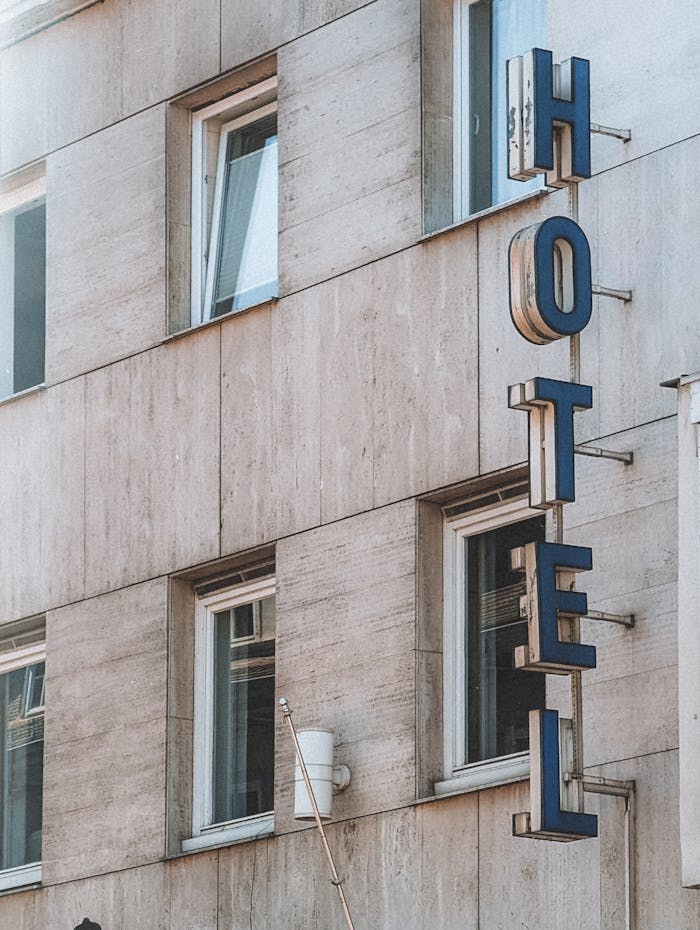 about-us Modern hotel facade in Marburg, Germany featuring vertical signage with stylish architecture.